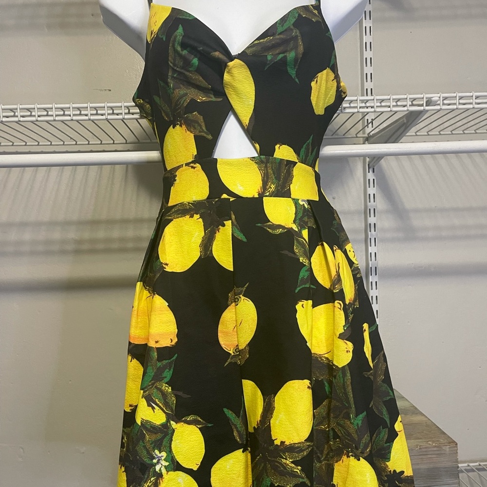 Lemon-design one-piece romper. Size M